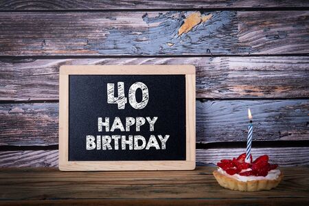 40 Happy Birthday. Cake with candle and greeting cardの写真素材