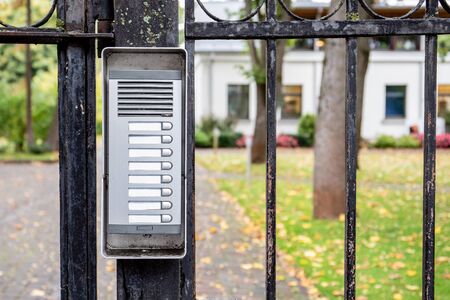Apartment house or office call button panel with apartment numbers and business names. Place for textの写真素材