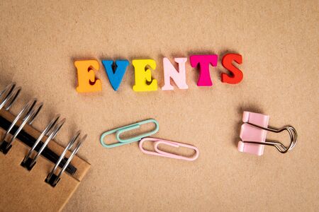 Events. Text from colorful wooden letters on cardboardの写真素材