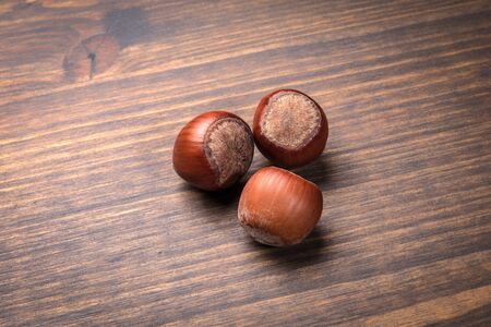 Hazelnuts on a wooden table. Food, snack background