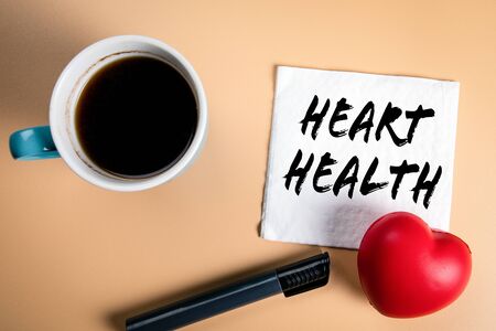 Heart health. Cardiology, donor, disease and recovery concept. Text on a napkin with a cup of coffee