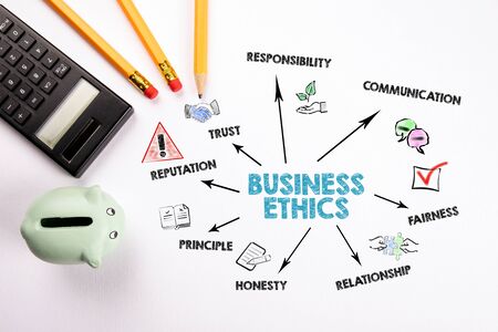 Business Ethics. Trust, Reputation, Communication and Relationship concept. Chart with keywords and icons. Calculator and writing instruments on a white deskの写真素材