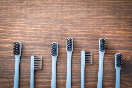 Toothbrushes, copy space on a wooden background. Dental hygieneの写真素材