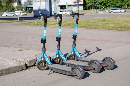Electro scooters on the side of the street. New way of public transportation service for rent using mobile appsのeditorial素材