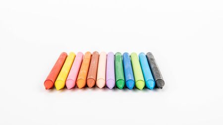 Colored pastel crayons on a white background. creativity, learning, arts and childrens