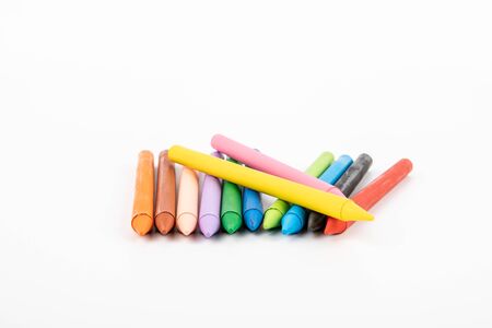 Colored pastel crayons on a white background. creativity, learning, arts and childrensの写真素材