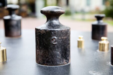 Counterweight for 2 kilograms or pounds. Old style product wighing. Trade and valueの写真素材