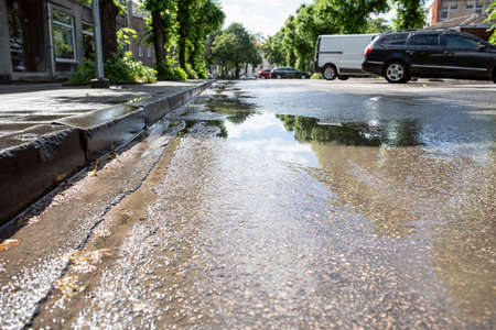 Streets after heavy summer rain with puddles
