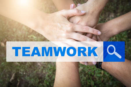 TEAMWORK. Searching information on the Internet. People putting their hands togetherの写真素材