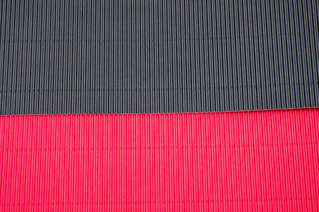 Corrugated application paper background. Red and black colorの写真素材