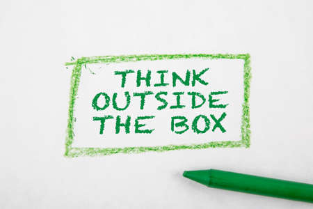 THINK OUTSIDE THE BOX concept. Text on a white page
