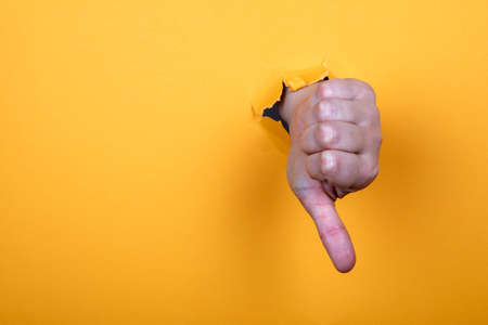 Thumb down. Social networks, customer satisfaction and business conceptの写真素材