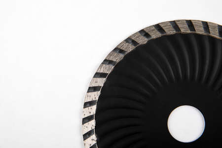 Diamond disc on a white background. Concrete, stone and tile cutting. Work and tools
