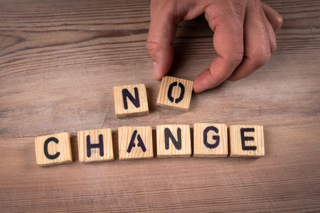 NO CHANGE. Alphabet letters on a wooden texture backgroundの写真素材