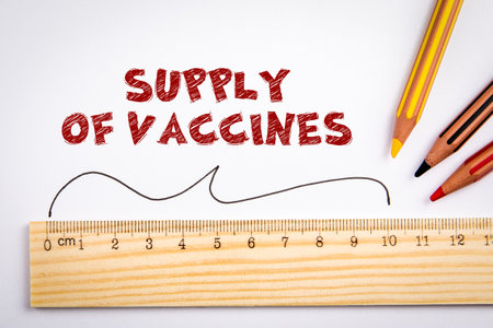 Supply of vaccines. Production, marketing and distribution concept. Wooden ruler and colored pencils