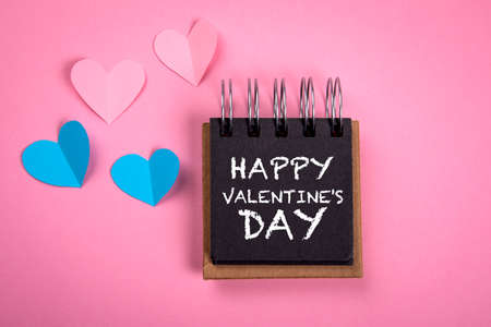 Happy Valentines Day. Pink and blue paper hearts. Note bookの写真素材