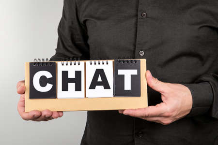 Chat, communication concept. Notebook in mans hands