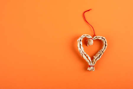 Heart shape decoration. Orange background for text and pictures. Copy space, mock upの写真素材