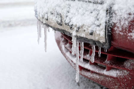 Icy and snowy car license plate. Winter seasonの写真素材