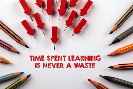 Time spent learning is never a waste. Red arrows and colored pencils on a white background