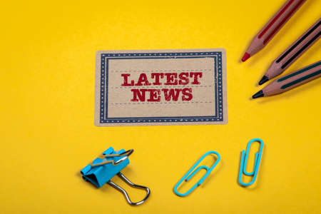 Latest News. Yellow notes and documents folder. Office suppliesの写真素材