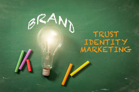 BRAND. Trust, Identity and Marketing concept. Green chalk boardの写真素材