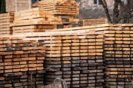 Sawn and stacked boards. Timber production, transportation and deliveryの写真素材