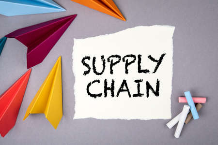 Supply Chain. Paper airplanes on a gray office deskの写真素材