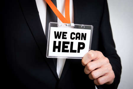 We Can Help. Businessman in suit and with security identity name card on a lanyardの写真素材