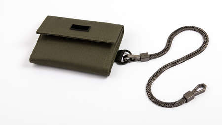Green wallet with a black chain on a white background