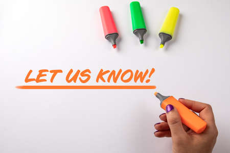 LET US KNOW. Text and colored markers on a white backgroundの写真素材