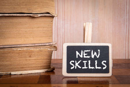 New Skills. Stack of books and chess boardの写真素材