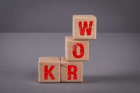 WORK. Wooden blocks with letters on a gray backgroundの写真素材