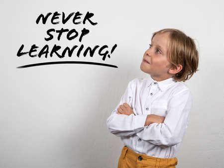 Never Stop Learning. Boy crossed his arms. Education and motivation