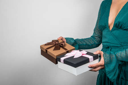 Christmas, birthday or Valentines Day gifts in a womans handsの写真素材