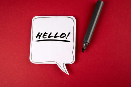 Hello. Speech bubble and black marker on red backgroundの写真素材