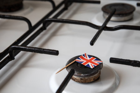 Natural gas exports and imports. High price. British flag on gas stoveの写真素材