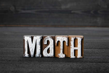 Math. Education, skills and science and physics concept. Word on a wooden backgroundの写真素材