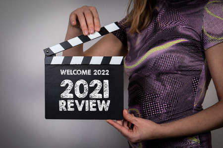 Welcome 2022 and 2021 Review. In a womans hands movie clapperの写真素材