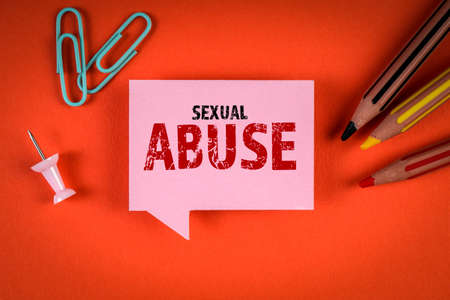 Sexual Abuse. Pink speech bubble with text on a red background