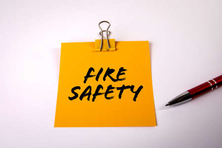 Fire Safety. Sheet of paper and pen on a white backgroundの写真素材