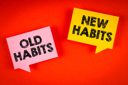 Old habits and new habits concept. Two speech bubbles on an orange backgroundの写真素材
