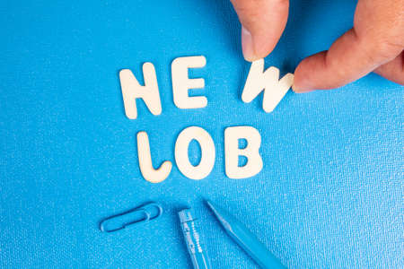 New Job. Text from white wooden letters on a blue backgroundの写真素材