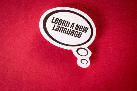 Learn A New Language. Speech bubble with text on red backgroundの写真素材