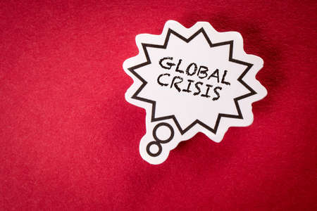 Global Crisis. Speech bubble with text on red backgroundの写真素材