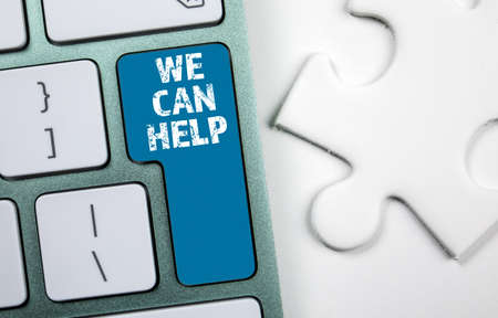 We Can Help. Text on a computer keyboard buttonの写真素材