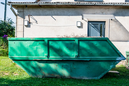 Large metal waste container for construction debris