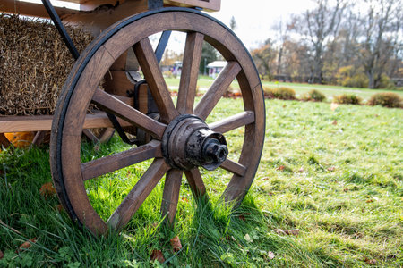 Wooden wheel on horse cart. Sunny autumn dayの写真素材