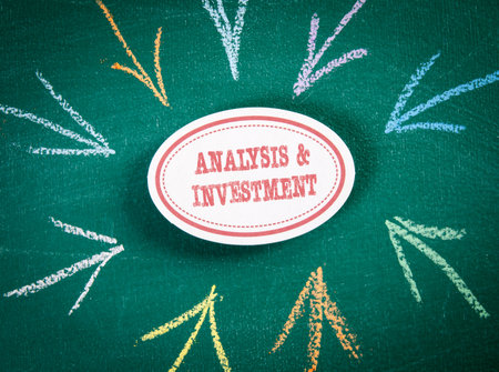 Analysis and Investment. Text and direction arrows on a green chalkboardの写真素材