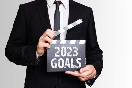2023 Goals. Businessman showing movie clapper. Business concept